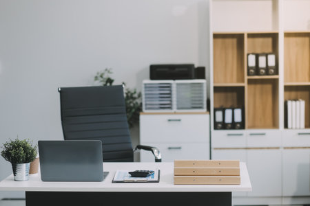Stylish workspace with desktop computer, office supplies, houseplant and books at office. desk work concept.の写真素材