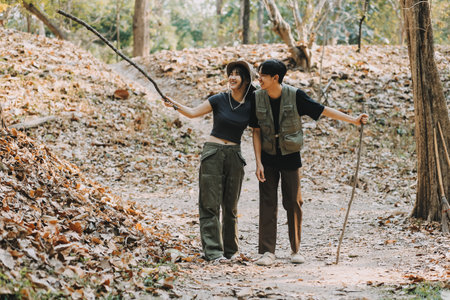 Asian couple sweet in tent inside on they camping trip, traveller relax and sleep togather in out door and camping tripの写真素材