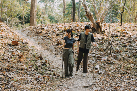 Asian couple sweet in tent inside on they camping trip, traveller relax and sleep togather in out door and camping tripの写真素材