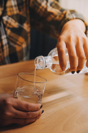 healthy beautiful young woman holding glass of water