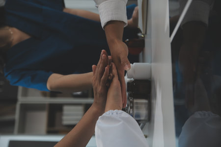 Doctor handshake and partnership in healthcare, medicine or trust for collaboration, unity or support.Team of medical experts shaking hands in teamwork for or success in hospitalの写真素材