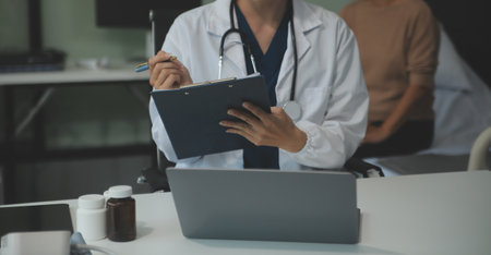 Female doctor explaining to patient results of model the process of patients. Diagnosis of diseases...