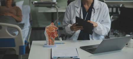 Female doctor explaining to patient results of model the process of patients. Diagnosis of diseases...
