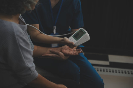 Doctor doing professional pressure examine her young patientの写真素材