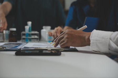 Group of professional medical doctor team meeting training medical in uniform working discussing and talk with patients record, teaching medic team, sit in hospital.health medical care conceptの写真素材