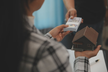 buy or sell real estate mortgage, Sale representative offer house purchase contract to buy a house or apartment and mortgage Money and Financial Conceptsの写真素材