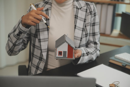 buy or sell real estate mortgage, Sale representative offer house purchase contract to buy a house or apartment and mortgage Money and Financial Conceptsの写真素材