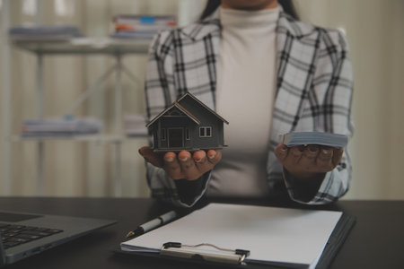 buy or sell real estate mortgage, Sale representative offer house purchase contract to buy a house or apartment and mortgage Money and Financial Conceptsの写真素材