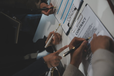 Judge gavel with Justice lawyers having team meeting at law firm background. Concepts of Law and Legal services.の写真素材