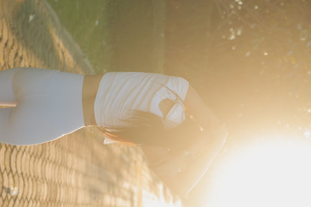 Young fitness woman runner stretching legs before run on cityの写真素材