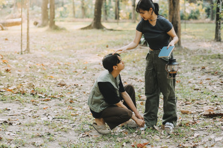 Asian couple sweet in tent inside on they camping trip, traveller relax and sleep togather in out...