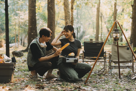 Asian couple sweet in tent inside on they camping trip, traveller relax and sleep togather in out...