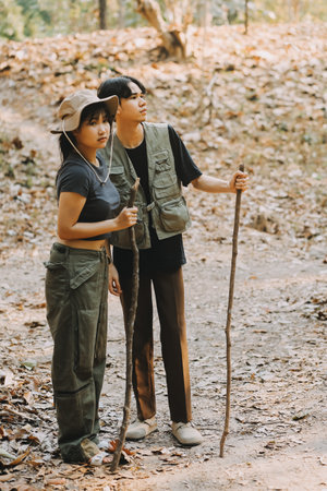 Asian couple sweet in tent inside on they camping trip, traveller relax and sleep togather in out door and camping tripの写真素材