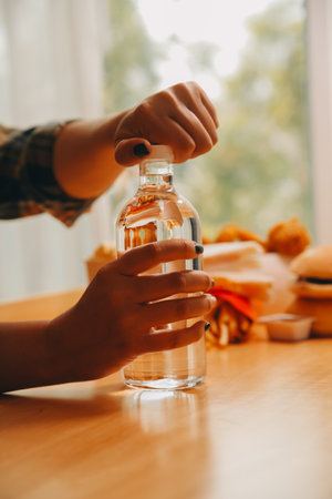 healthy beautiful young woman holding glass of waterの写真素材