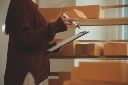 Portrait of young business asian woman online working in office desk use computer copyspace. Success business people employee, freelance SME online marketing work at home, coworking space conceptの写真素材