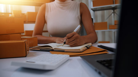 Portrait of young business asian woman online working in office desk use computer copyspace. Success business people employee, freelance SME online marketing work at home, coworking space conceptの写真素材
