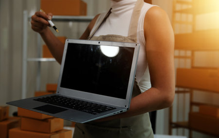 Portrait of young business asian woman online working in office desk use computer copyspace. Success...