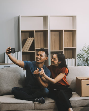 Happy excited, smiling asian young couple love using tablet pc, great deal or business success,...