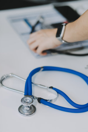 Stethoscope with prescription clipboard and Laptop ,Doctor working an Exam, Healthcare and medical concept,test results in background,vintage color,selective focusの写真素材
