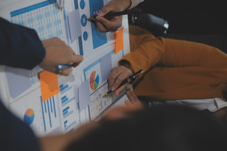 Business team collaboration discussing working analyzing with financial data and marketing growth report graph in team, presentation and brainstorming to strategy planning making profit of company.の写真素材