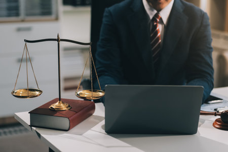 Male lawyer working with contract papers and wooden gavel on tabel in courtroom. justice and law ,attorney, court judge, concept.の写真素材
