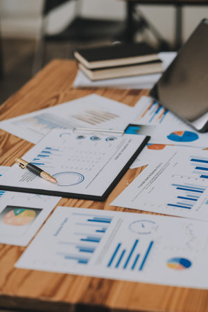 Happy young asian businesswoman sitting on her workplace in the office. Young woman working at laptop in the office.の写真素材