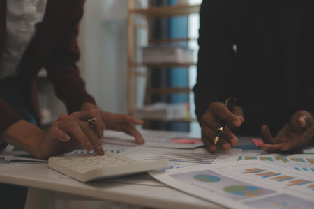 Fund managers team consultation and discuss about analysis Investment stock market at officeの写真素材