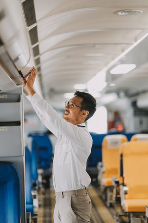 Portrait of a trained airplane captain in uniform preparing to fly in a simulator cockpit.の写真素材