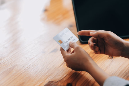 Happy asian woman using smartphone shopping online with credit card. Lifestyle. Easy pay using smart...