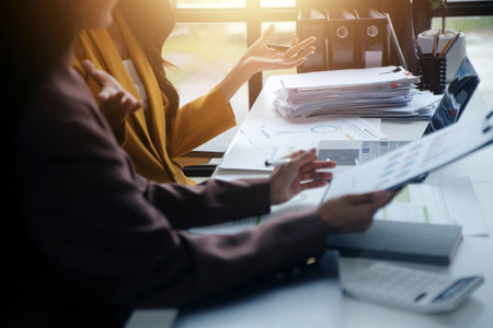 Team of business people working together in the meeting room office, teamwork background charts and graphs banner, double exposure successful teamwork,business planning concept.の写真素材