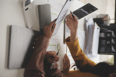 Team of business people working together in the meeting room office, teamwork background charts and graphs banner, double exposure successful teamwork,business planning concept.の写真素材