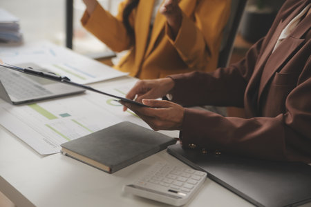Team of business people working together in the meeting room office, teamwork background charts and graphs banner, double exposure successful teamwork,business planning concept.の写真素材