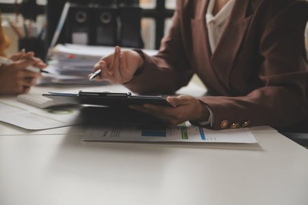 Team of business people working together in the meeting room office, teamwork background charts and graphs banner, double exposure successful teamwork,business planning concept.の写真素材