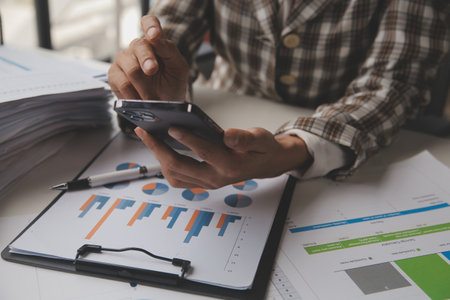 Attractive boss businesswoman of asian indian descent people management accounting experts professionals with specialized knowledge in management accounting, contributing to financial excellence.の写真素材