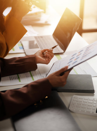 Team of business people working together in the meeting room office, teamwork background charts and graphs banner, double exposure successful teamwork,business planning concept.の写真素材