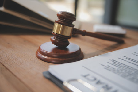 Judge gavel with Justice lawyers having team meeting at law firm background. Concepts of Law and Legal services.の写真素材