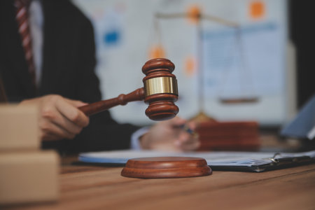 Judge gavel with Justice lawyers having team meeting at law firm background. Concepts of Law and...