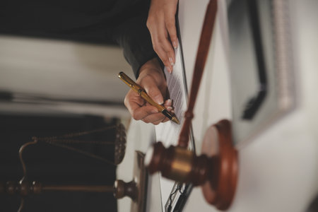 Law theme, gavel or mallet of the judge, lawyer enforcement officers, evidence-based cases taken into account in the court abount business, legislation.の写真素材