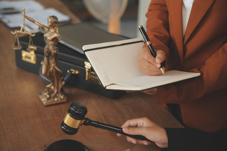 Lawyer, legal advisor, businessman brainstorming information on agreement details Business contracts in legal processing books for accuracy in contract documents. joint financial investment.の写真素材