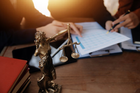 Lawyer, legal advisor, businessman brainstorming information on agreement details Business contracts in legal processing books for accuracy in contract documents. joint financial investment.の写真素材