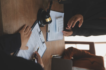 Mediation client meeting lawyer consulting government help, Businessman and Male lawyer or judge consult having team meeting with client, Law and Legal services concept.の写真素材