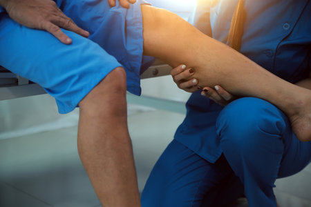 Physical therapists work with patients in close-up clinics. The concept of rehabilitation of physical health, the doctor gives advice to the patient. Ankle problems and muscle injuriesの写真素材