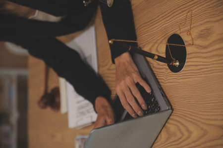 Judge gavel with Justice lawyers having team meeting at law firm background. Concepts of Law and Legal services.の写真素材