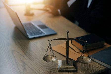 Judge gavel with Justice lawyers having team meeting at law firm background. Concepts of Law and Legal services.の写真素材