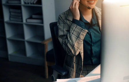 Call center, computer and business with woman in office for customer service, technical support and advice. Technology, contact us and communication with employee operator in help desk agencyの写真素材