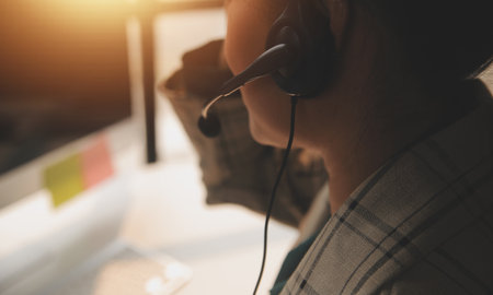 Call center, computer and business with woman in office for customer service, technical support and advice. Technology, contact us and communication with employee operator in help desk agencyの写真素材
