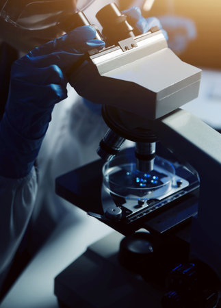 professional chemist woman laboratory using scientific microscope for science research, chemistry scientist with microbiology medicals equipment technology to working with medicine biology experimentの写真素材