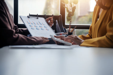 Team of business people working together in the meeting room office, teamwork background charts and graphs banner, double exposure successful teamwork,business planning concept.の写真素材
