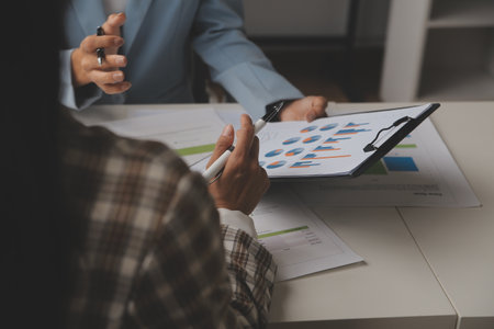 Team of business people working together in the meeting room office, teamwork background charts and graphs banner, double exposure successful teamwork,business planning concept.の写真素材
