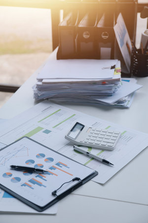 Team of business people working together in the meeting room office, teamwork background charts and graphs banner, double exposure successful teamwork,business planning concept.の写真素材